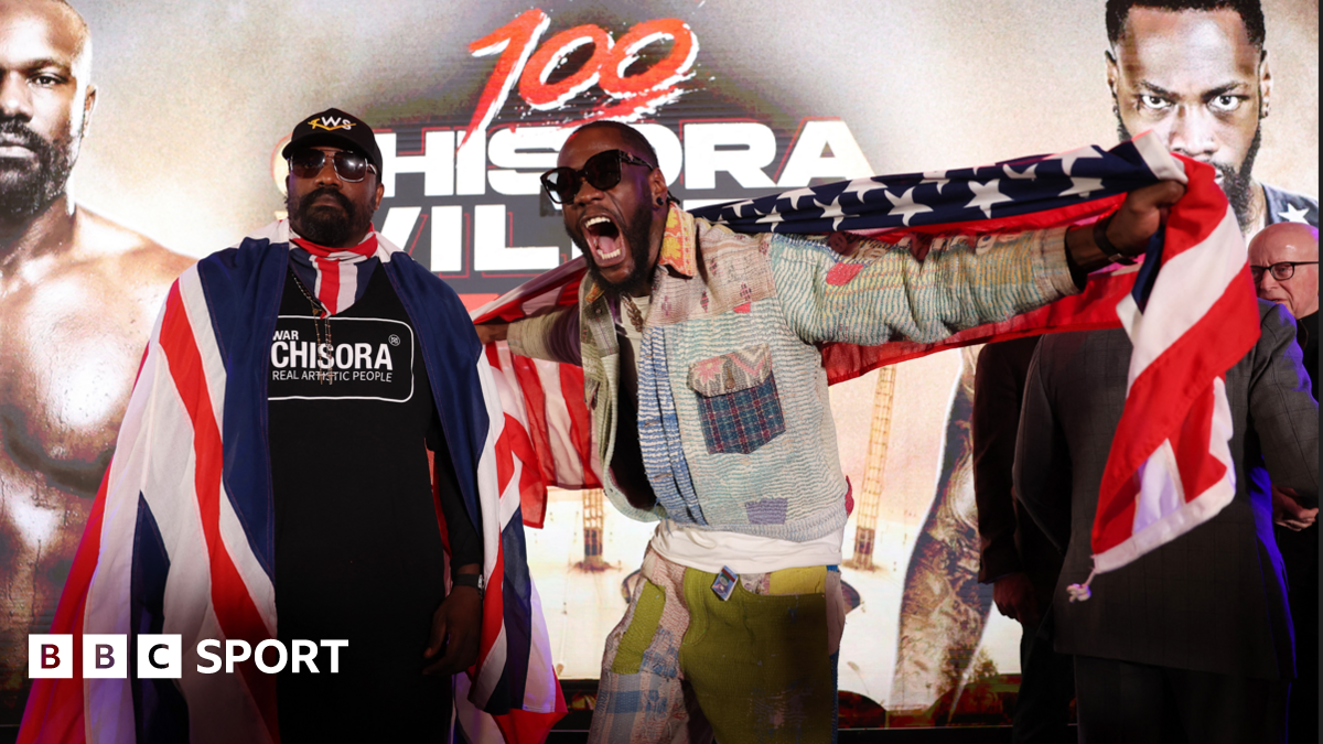 Derek Chisora stands beside Deonty Wilder as he shouts