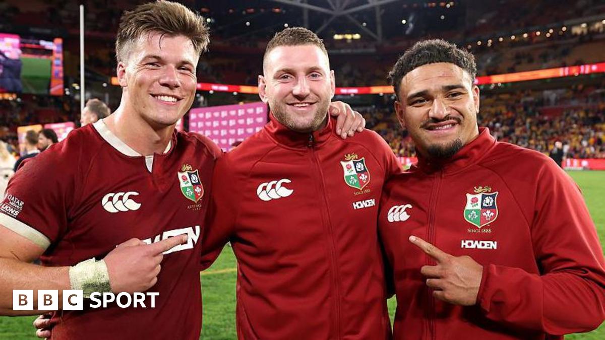 Huw Jones, Finn Russell and Sione Tuipulotu after the Lions' first Test win in Australia