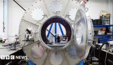A large metal cylinder in the middle of a laboratory.