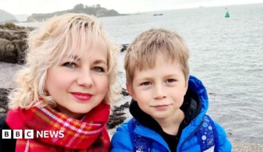 Svitlana Santos pictured with her son in front of the sea.