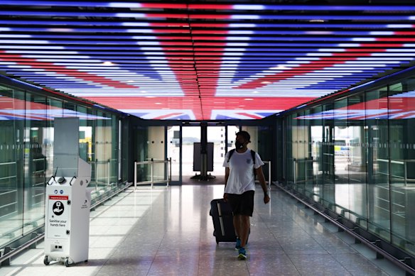 A traveller walks through Terminal 5 of London’s Heathrow Airport.
