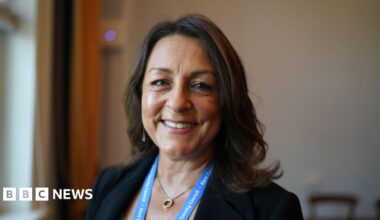 A treated image of a glass beaker with two hearts inside