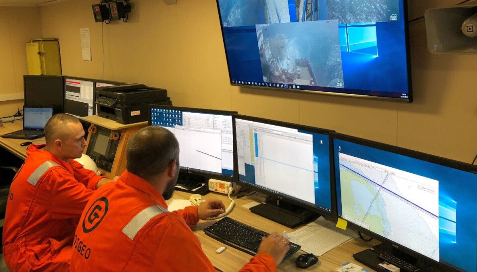 Lab workers doing surveys onboard the Professor Logachev.