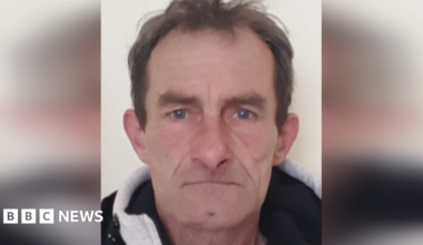 A mugshot of Andrzej Mucha, who has short, brown hair.