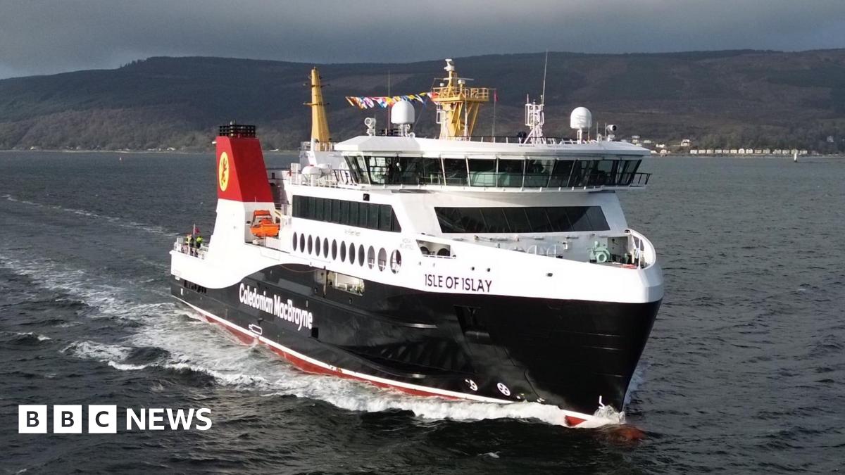 A black and white ferry on water with Caledonian MacBrayne written on it, with Isle of Islay written near the front
