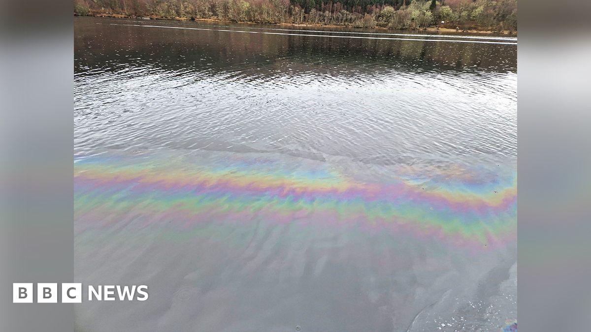 A street in a village with hills in the background