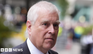 Andrew Mountbatten-Windsor, pictured in September 2025, wearing a dark suit and black tie.