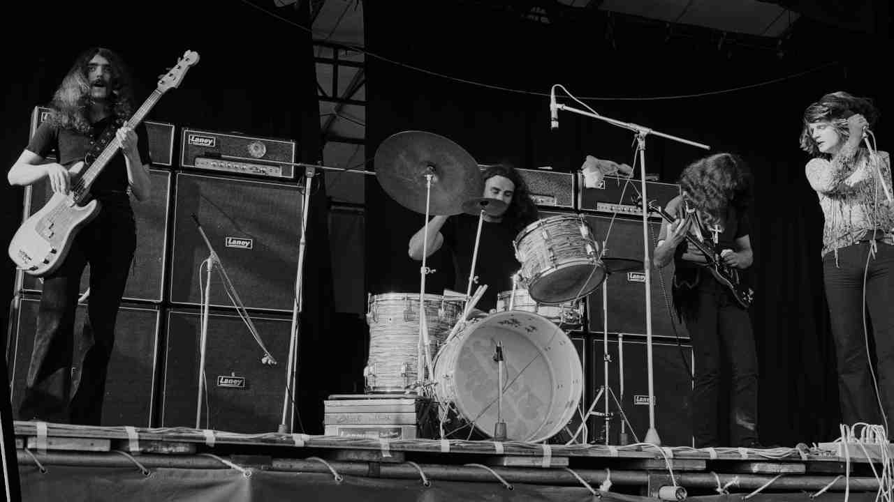Black Sabbath performing onstage in 1970