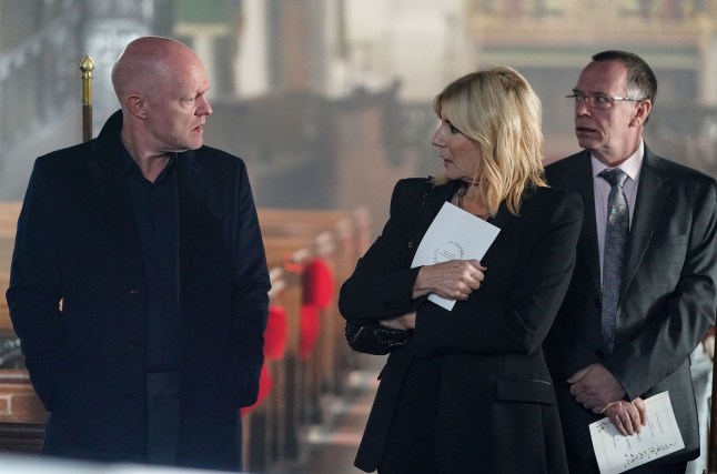 Max and Cindy looking at each other in shock while Ian watches on nervously in EastEnders