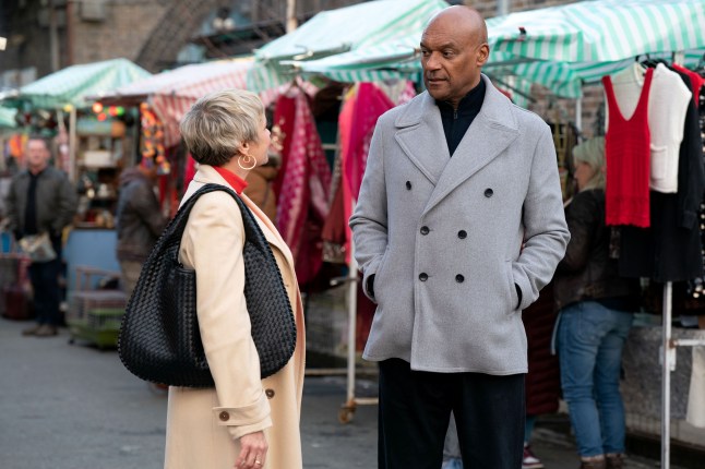 George Knight and Nicola Mitchell talking in Albert Square in EastEnders