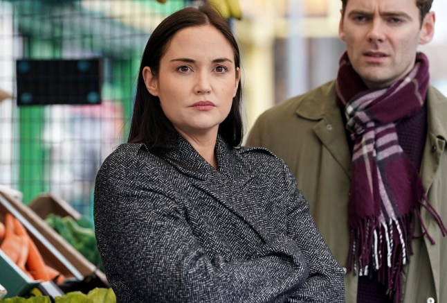 Lauren looks upset as Peter stares ahead in EastEnders