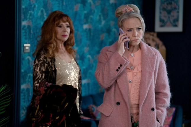 Linda Carter on the phone next to Elaine Peacock in EastEnders
