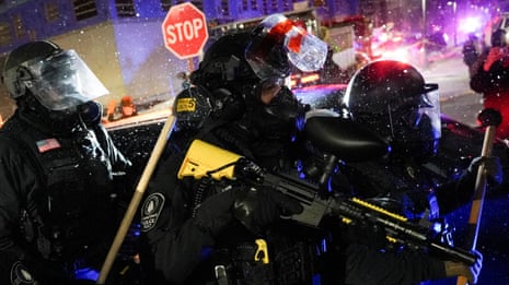 Protests at Minneapolis hotel where Gregory Bovino believed to be staying – video