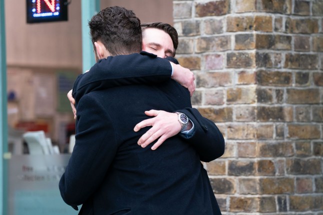 Callum Highway and Johnny Carter hugging in EastEnders