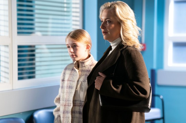Clare Bates standing with Lexi Pearce in a hospital corridor in EastEnders.