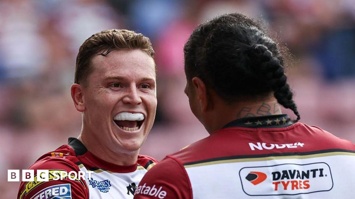 Wigan Warriors' Jai Field celebrates with Patrick Mago after scoring a try.