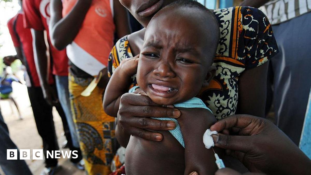 A baby receives a vaccine in West Africa.