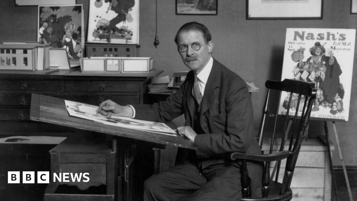 Artist and cartoonist William Heath Robinson (1872 - 1944) at his drawing board.