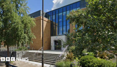 York House, Windsor - a glass and brick-fronted building fronted by trees and a short flight of steps