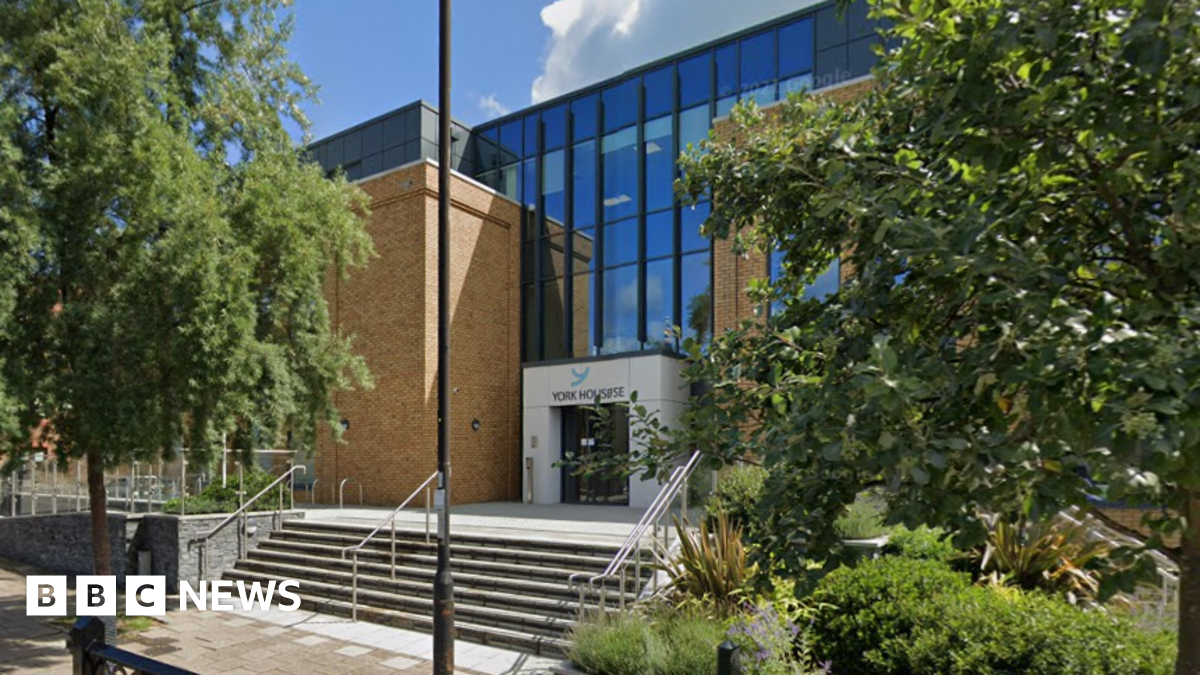 York House, Windsor - a glass and brick-fronted building fronted by trees and a short flight of steps
