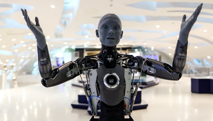 A humanoid robot staff greets visitors at an exhibition in Dubais Museum of the Future, United Arab Emirates. — Reuters
