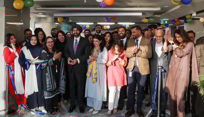 World Bank President Ajay Banga cuts a ribbon during the inauguration of the International Finance Corporation (IFC) office in Karachi on February 4, 2026. — Reuters