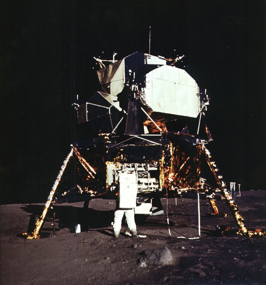 Buzz Aldrin stands next to the lunar module on the surface of the moon during Apollo 11.