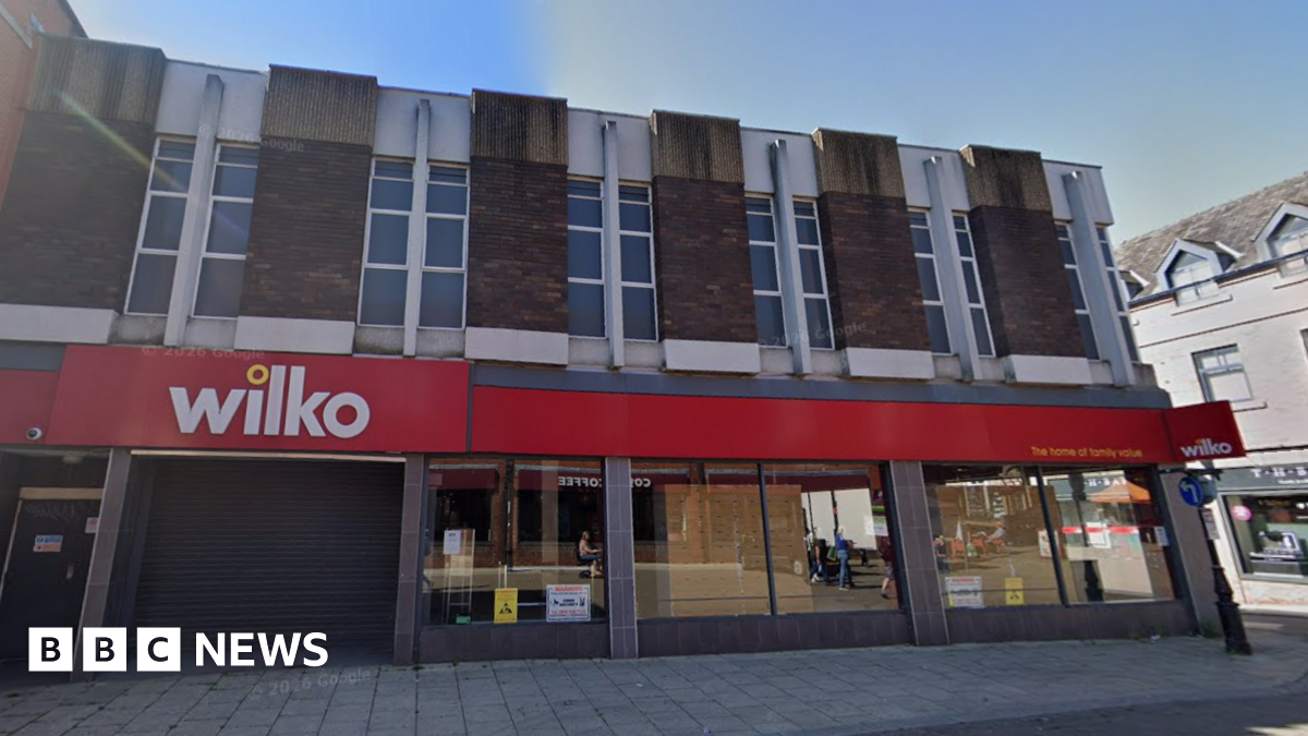 Shutters down on a Wilko's store with blue sky above