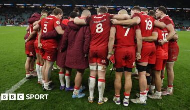 Wales players in a huddle after the 48-7 defeat against England