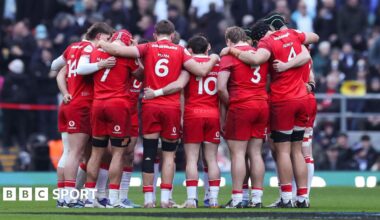Wales players in a huddle against England