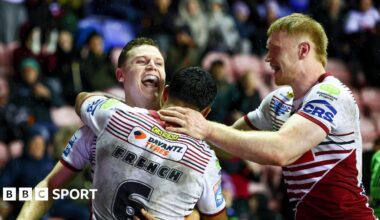 Jay Field celebrates scoring Wigan's sixth try with his team-mates