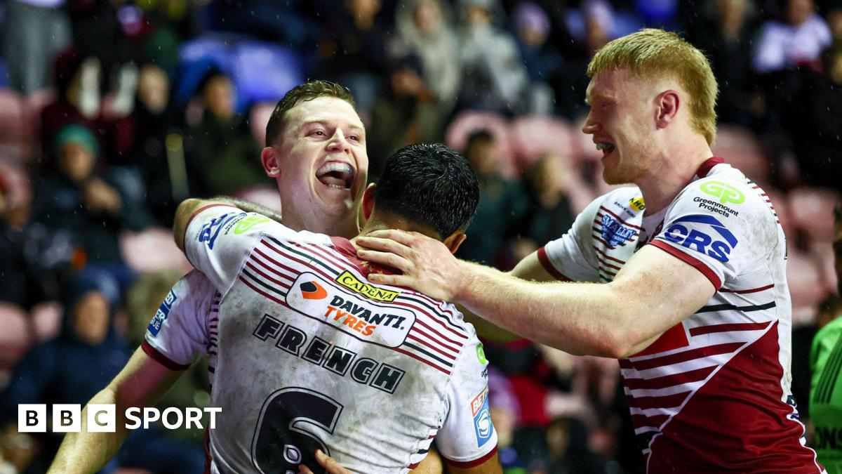Jay Field celebrates scoring Wigan's sixth try with his team-mates