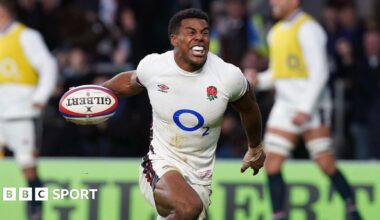 England wing Immanuel Feyi-Waboso celebrating with the ball in his right hand