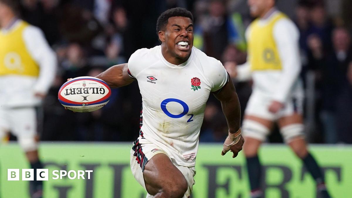 England wing Immanuel Feyi-Waboso celebrating with the ball in his right hand