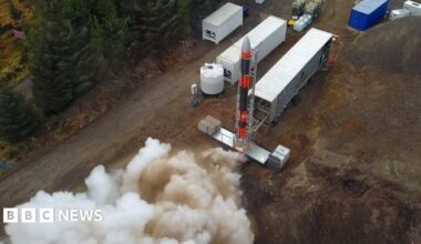 Smoke emerges from the engines of a rocket on a temporary launch site in the Highlands.