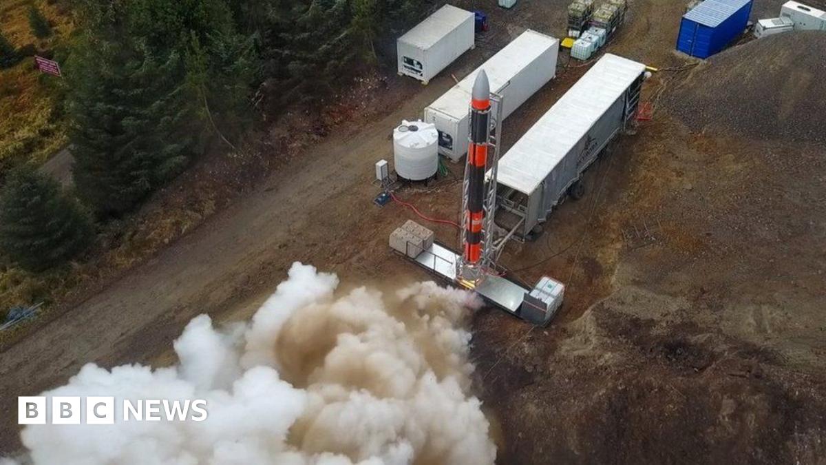 Smoke emerges from the engines of a rocket on a temporary launch site in the Highlands.
