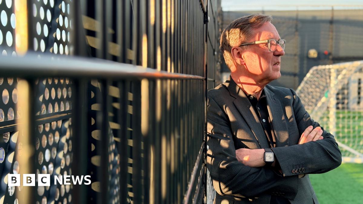 Alan Milburn on a street in Newcastle. He is wearing a dark coat and has his hands in the pockets.