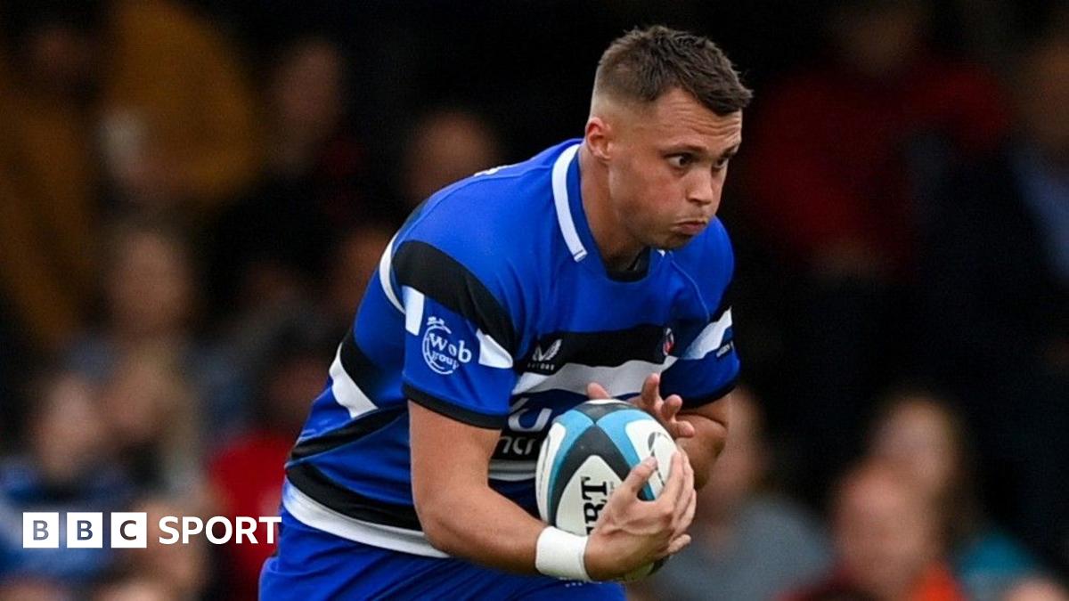 Bath's Tom Carr-Smith holds the ball with a determined look on his face