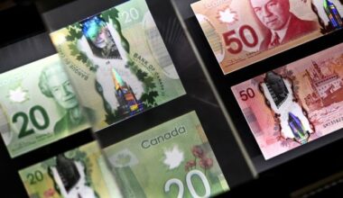 A magnifying glass enlarges the holographic image of Parliament Hill