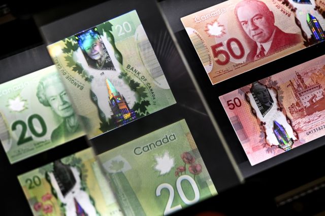 A magnifying glass enlarges the holographic image of Parliament Hill