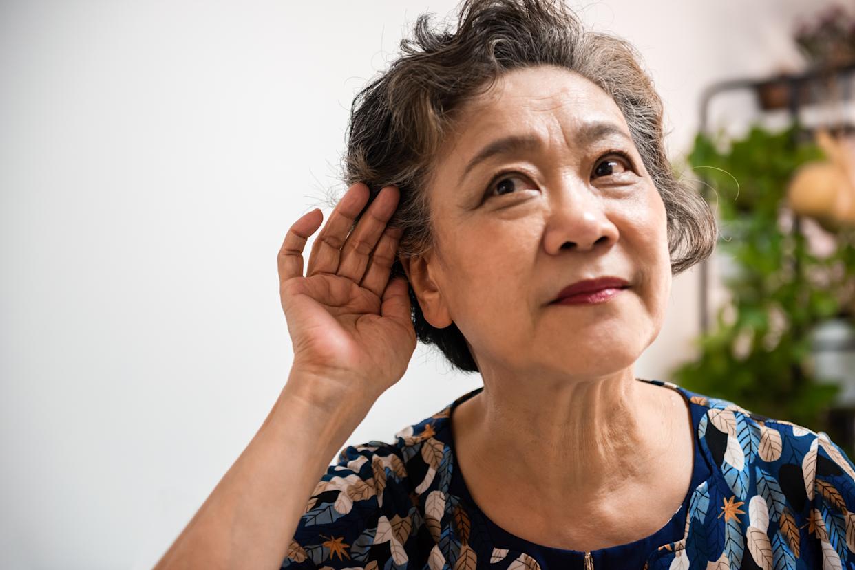 Elderly woman with hearing loss