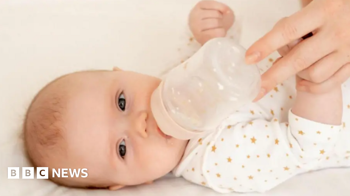 A baby with a bottle