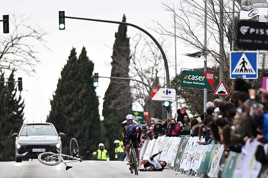 UBEDA, SPAIN - FEBRUARY 16: A general view of Thomas Pidcock of Great Britain and Team Pinarello Q36.5 Pro Cycling and Jan Christen of Switzerland and UAE Team Emirates - XRG sprint at finish line while Maxim Van Gils of Belgium and Team Red Bull - BORA - hansgrohe reacts after crashing at the finish line during the 5th Clasica Jaen Paraiso Interior 2026 a 154.2km one day race from Ubeda to Ubeda on February 16, 2026 in Ubeda, Spain.