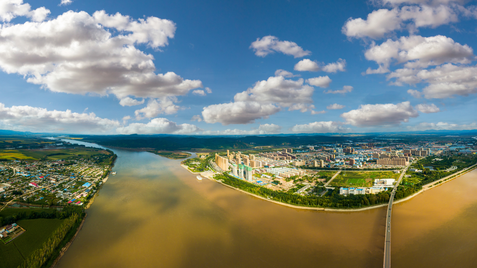 Photograph of Yilan city along the banks of a river