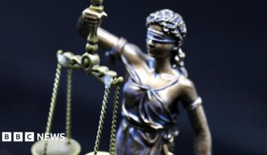 A statue of Greek Lady Justice holding scales