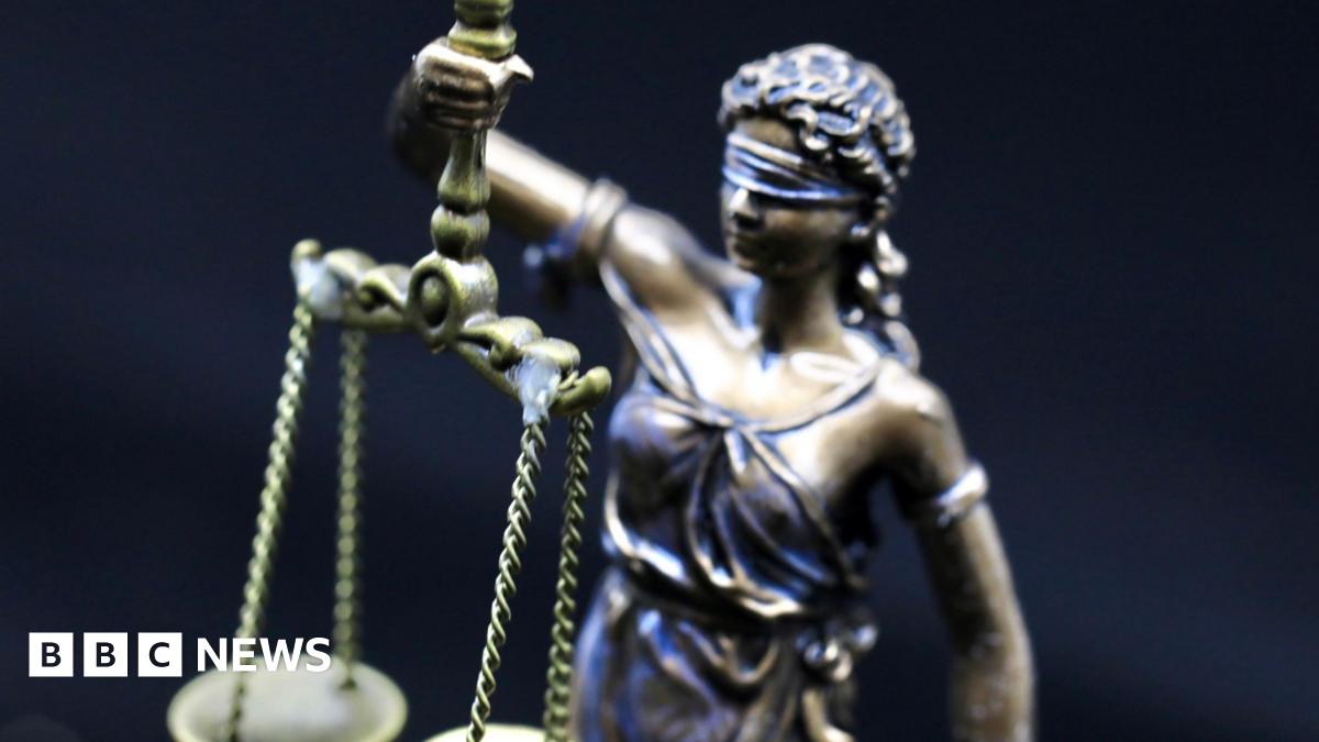 A statue of Greek Lady Justice holding scales