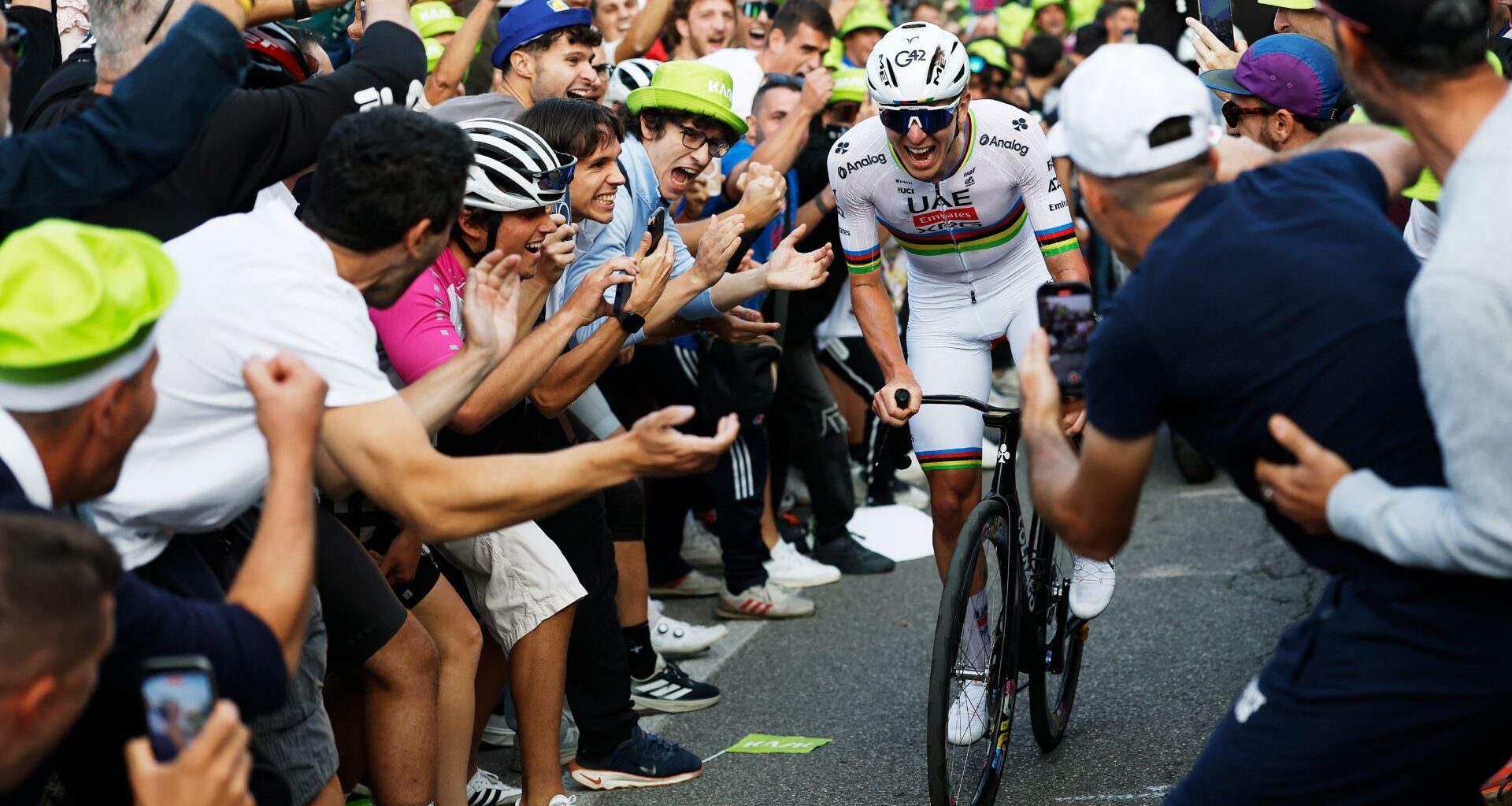 Tadej Pogacar surrounded by fans