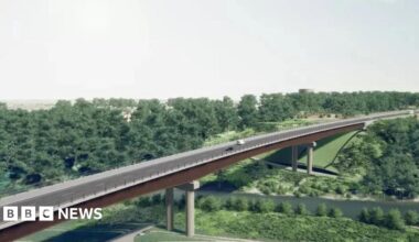 A drawing of a planned road bridge over green fields and trees with a river running below it