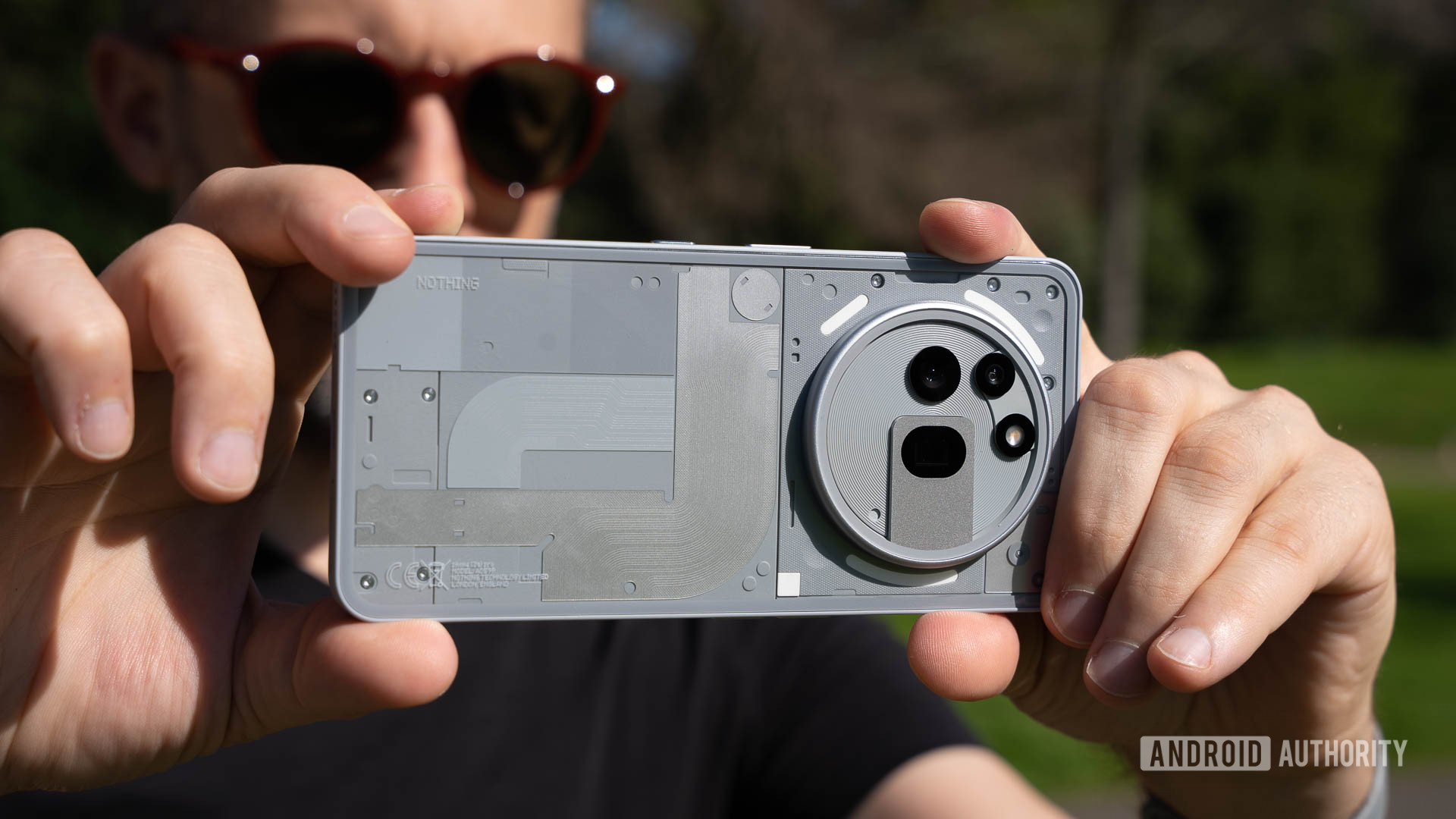 A man taking a photo with the Nothing Phone 3a Pro A man taking a photo with the Nothing Phone 3a Pro