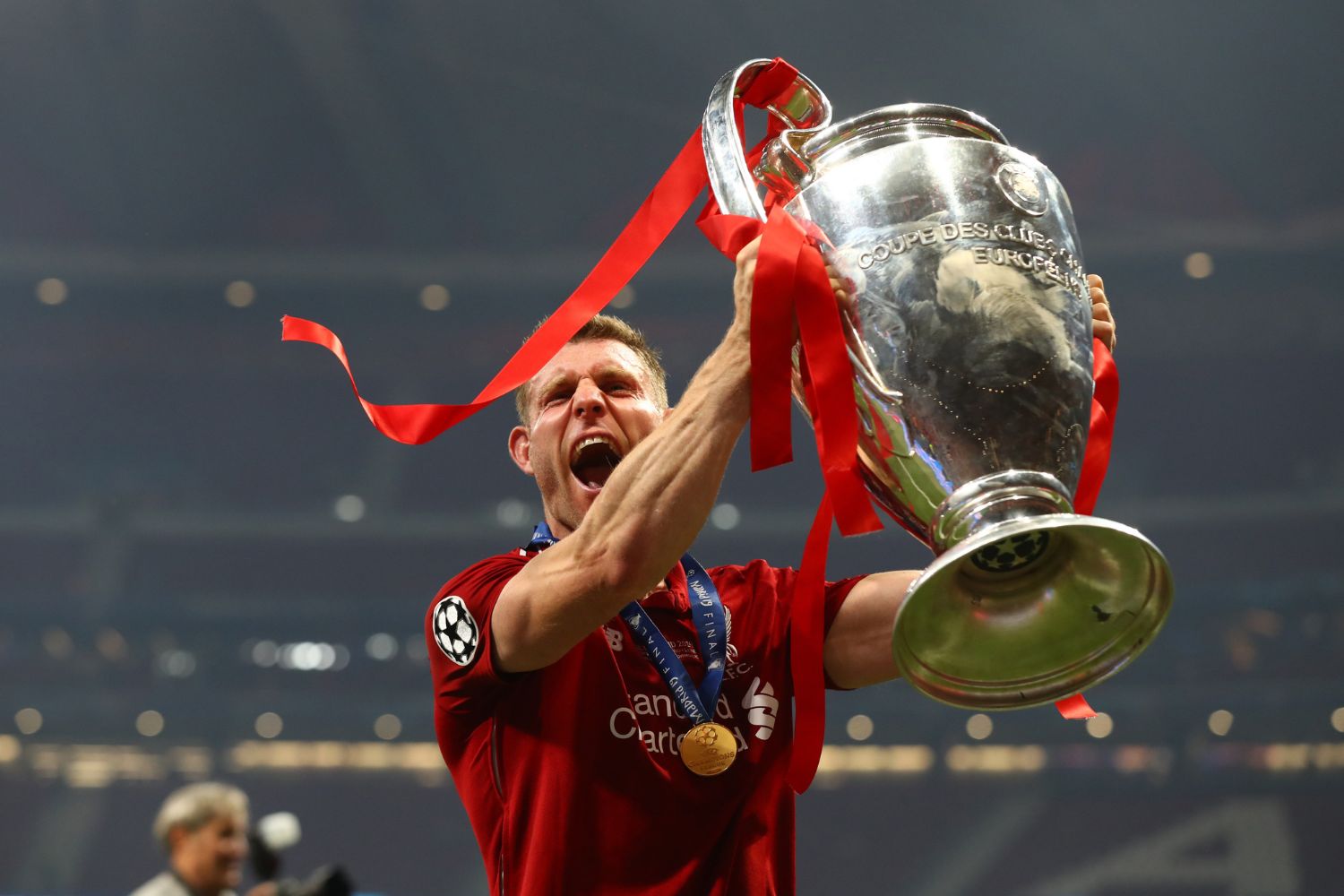 James Milner of Liverpool celebrates with the Champions League Trophy
